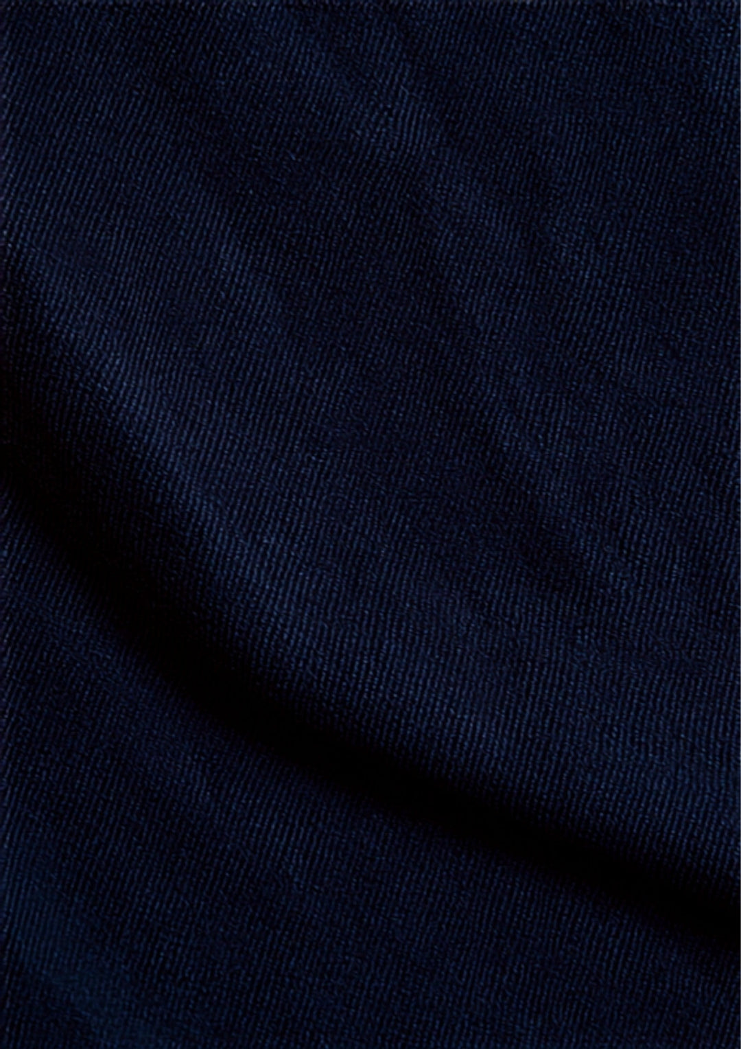 High-contrast denim whiskers on deep indigo Japanese selvedge jeans